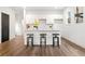 Stylish kitchen with white cabinets, quartz countertops, and hardwood floors at 2664 Brown Nw St, Atlanta, GA 30318
