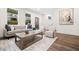 Bright living room with neutral decor, a modern sofa, and a decorative wood coffee table at 2664 Brown Nw St, Atlanta, GA 30318