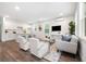 Open concept living room with hardwood floors connecting living and kitchen areas at 2664 Brown Nw St, Atlanta, GA 30318
