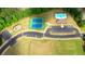 Overhead view showcasing a community with tennis courts, a pool area, clubhouse, and a playground at 5441 Flat Rock Point Pt, Stonecrest, GA 30038
