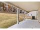 Covered back patio features natural view and view of the back of the house at 5441 Flat Rock Point Pt, Stonecrest, GA 30038