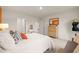 Bright bedroom with white walls and bed and views into a walk-in closet at 5441 Flat Rock Point Pt, Stonecrest, GA 30038