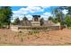 Community entrance to Flat Rock Hills with stone monument and landscaping at 5441 Flat Rock Point Pt, Stonecrest, GA 30038