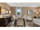 Charming dining room with hardwood floors, neutral decor, and stylish furniture at 5441 Flat Rock Point Pt, Stonecrest, GA 30038