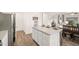 Kitchen features white cabinets, granite countertops, stainless steel appliances, and pantry at 5441 Flat Rock Point Pt, Stonecrest, GA 30038