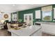 Bright kitchen with white cabinetry, granite countertops, stainless steel appliances, and an island at 5441 Flat Rock Point Pt, Stonecrest, GA 30038