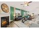 Spacious living room with a fireplace, comfortable seating, and an open layout connecting to the kitchen at 5441 Flat Rock Point Pt, Stonecrest, GA 30038