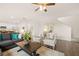Bright living space boasts hardwood floors, a comfortable seating arrangement, and convenient access to the kitchen and staircase at 5441 Flat Rock Point Pt, Stonecrest, GA 30038