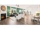 Open-concept living area showcases hardwood floors, a fireplace, and seamless flow into the dining and kitchen spaces at 5441 Flat Rock Point Pt, Stonecrest, GA 30038