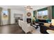 Cozy living room with fireplace, ceiling fan, and ample natural light at 5441 Flat Rock Point Pt, Stonecrest, GA 30038