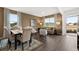 Inviting living and dining area boasts hardwood floors, neutral tones, and plenty of natural light at 5441 Flat Rock Point Pt, Stonecrest, GA 30038