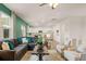 Open-concept living space features a modern design with hardwood floors, an inviting seating area, and a bright kitchen at 5441 Flat Rock Point Pt, Stonecrest, GA 30038