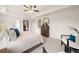 Bright main bedroom featuring a ceiling fan, carpeted floor, and neutral paint at 5441 Flat Rock Point Pt, Stonecrest, GA 30038