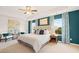 Serene main bedroom with tray ceilings, a plush bed, and coordinated decor with windows offering scenic views at 5441 Flat Rock Point Pt, Stonecrest, GA 30038