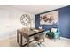Bright office with blue accent wall, clock and decor, and comfortable seating at 5441 Flat Rock Point Pt, Stonecrest, GA 30038