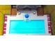 Overhead view of a community pool with blue water, a splash umbrella, lounge chairs and surrounding fence at 5441 Flat Rock Point Pt, Stonecrest, GA 30038