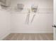 Walk-in closet with carpet flooring, wire shelving, and ample storage space at 5441 Flat Rock Point Pt, Stonecrest, GA 30038