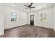 Spacious bedroom with wood flooring, recessed lighting, and two windows providing natural light at 2680 Brown Nw St, Atlanta, GA 30318