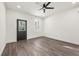 Cozy bedroom with wood flooring, recessed lights, and access to the backyard through a glass door at 2680 Brown Nw St, Atlanta, GA 30318