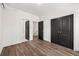 Bedroom with gray floors and doors that lead to a bathroom and walk-in closet at 2680 Brown Nw St, Atlanta, GA 30318