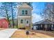 Charming two-story home featuring a light blue exterior, front porch, and a newly installed driveway at 2680 Brown Nw St, Atlanta, GA 30318