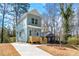 Charming two-story home with a light blue exterior, complemented by a well-maintained front yard at 2680 Brown Nw St, Atlanta, GA 30318