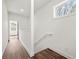 Hallway features white walls and wood flooring with a handrail at 2680 Brown Nw St, Atlanta, GA 30318