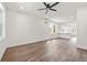 Bright living room featuring modern ceiling fan, recessed lighting, wood floors, and mini split a/c at 2680 Brown Nw St, Atlanta, GA 30318