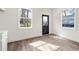 Bright living area showcases new wood flooring, white trim, and natural light at 2680 Brown Nw St, Atlanta, GA 30318