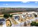 An aerial view of multiple houses surrounding a big pond with a line of trees in the background at 2738 Lakewater Way, Snellville, GA 30039