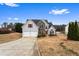 Beautiful two-story home with a two-car garage and well-maintained lawn on a sunny day at 2738 Lakewater Way, Snellville, GA 30039