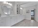 Elegant bathroom with dual sinks, a vanity, and great natural light at 2930 Monticello Dr, Cumming, GA 30041