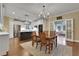 Open dining room with views into the kitchen and a cozy living room with french doors at 2930 Monticello Dr, Cumming, GA 30041