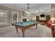 Spacious game room with a pool table, fireplace, and comfortable seating area at 2930 Monticello Dr, Cumming, GA 30041