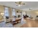 Inviting living room featuring hardwood floors, fireplace, and abundant natural light at 2930 Monticello Dr, Cumming, GA 30041