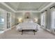 Tranquil main bedroom showcasing a tray ceiling and an ensuite bathroom at 2930 Monticello Dr, Cumming, GA 30041