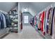 Spacious walk-in closet providing ample storage with shelving and hanging racks at 2930 Monticello Dr, Cumming, GA 30041