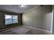 Neutral bedroom with carpet, a window letting in natural light, and space for relaxation at 4195 Bradley Dr, Snellville, GA 30039