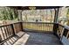 This backyard deck has railing with view of the grassy backyard and mature trees at 4195 Bradley Dr, Snellville, GA 30039