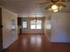 Spacious dining room with hardwood floors, neutral walls, and natural light, adjacent to the kitchen at 455 Sweet Water Trl, Conyers, GA 30094