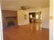 Open living room with hardwood floors, brick fireplace, and view of kitchen at 455 Sweet Water Trl, Conyers, GA 30094