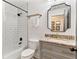 Modern bathroom featuring subway tile shower, elegant fixtures, and granite countertop vanity at 5705 Odell St, Cumming, GA 30040