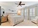 Bright bedroom with large windows, plantation shutters, and stylish decor at 5705 Odell St, Cumming, GA 30040