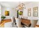 Formal dining room featuring a modern chandelier and unique decor at 5705 Odell St, Cumming, GA 30040