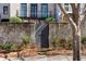 Exterior view of a brick wall surrounding the home with a gate entrance at 5705 Odell St, Cumming, GA 30040