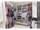 Spacious walk-in closet with custom shelving and ample storage for clothes and accessories at 5705 Odell St, Cumming, GA 30040