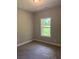 Bedroom with neutral walls, carpeted floors and a large window for natural light at 8141 Hickory Dr, Covington, GA 30014