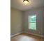 Neutral bedroom features a window, and new carpet at 8141 Hickory Dr, Covington, GA 30014