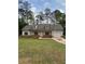 Charming one-story home featuring neutral siding, dormer windows, freshly laid grass, and an attached garage at 8141 Hickory Dr, Covington, GA 30014
