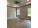 Spacious main bedroom includes a trey ceiling, recessed lighting, and large windows at 8141 Hickory Dr, Covington, GA 30014
